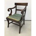 Regency style mahogany elbow chair with cane seat