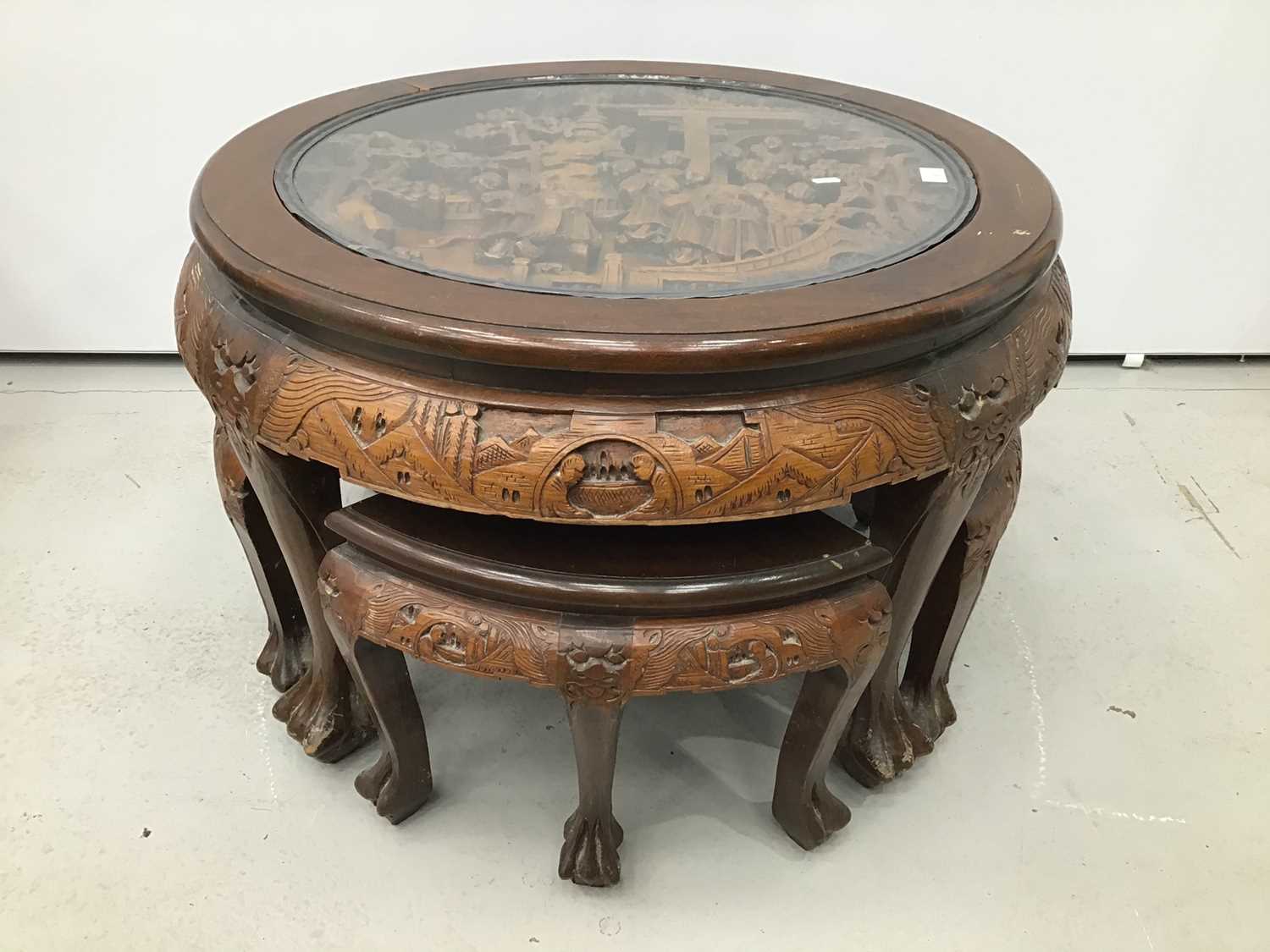 Chinese circular carved coffee table with integral nest of tables