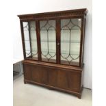 Good quality George III-style mahogany two height display cabinet, the top enclosed by gothic astrag