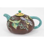 Chinese Yixing teapot, of pumpkin form, decorated in relief and in enamels with foliate patterns and