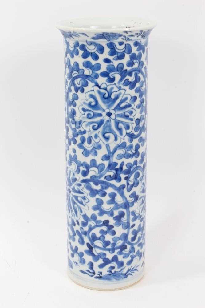 Chinese blue and white porcelain sleeve vase, c.1900, painted with a scrolling foliate pattern, four