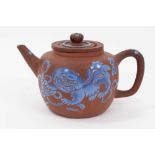 Chinese Yixing teapot and strainer, enamelled in blue with a foo dog, and auspicious symbols verso,