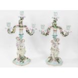Pair of Dresden figural porcelain candelabra, with three branch section fitting on to a central colu