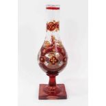 Bohemian glass hookah base, decorated with gilt foliate patterns on a red ground, 29.5cm height