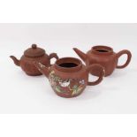 Three Chinese Yixing teapots, including one enamelled with birds and flowers, another of plain melon