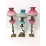Pair of Edwardian peg lamps, together with another