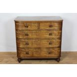 George IV mahogany bow front chest of two short and three long drawers with turned mahogany handles