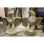 Pair of composition concrete statues of eagles