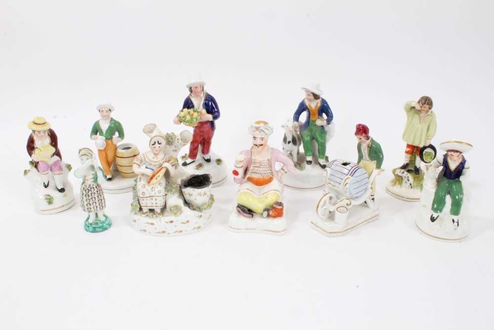 Collection of ten Staffordshire figures, including a Turk, a man pushing a wheelbarrow, etc, between