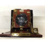 Sanderson Regular mahogany and brass field camera, with Zeiss Tessar lens and darkslides