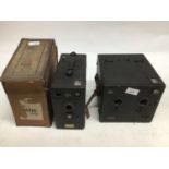 Four early falling plate box cameras including Midg with an early large stereo box camera retailed b