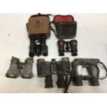 Five early pairs of binoculars including an early military pair by Goerz