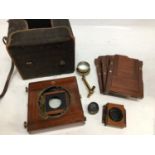 Cased brass and mahogany field camera, no name with double darkslides, lens and accessories