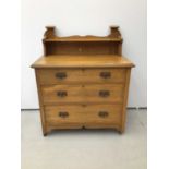 Art. Nouveau satinwood dressing chest of three long drawers with ledge back