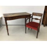 Victorian figured mahogany serpentine front writing table, together with a Regency mahogany carver c