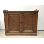 Late Victorian oak cupboard with two panelled doors
