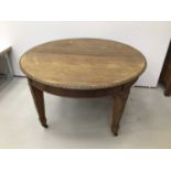Early. 20th century mahogany dining table with extra leaf