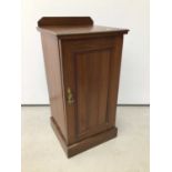 Late 19th / early 20th century pot cupboard, enclosed by panelled door on plinth base, 43cm wide x 4