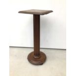Victorian mahogany torchere stand, with square platform and fluted column on circular base, 87cm hig