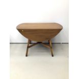 Ercol elm drop leaf table together with a set five Ercol dining chairs