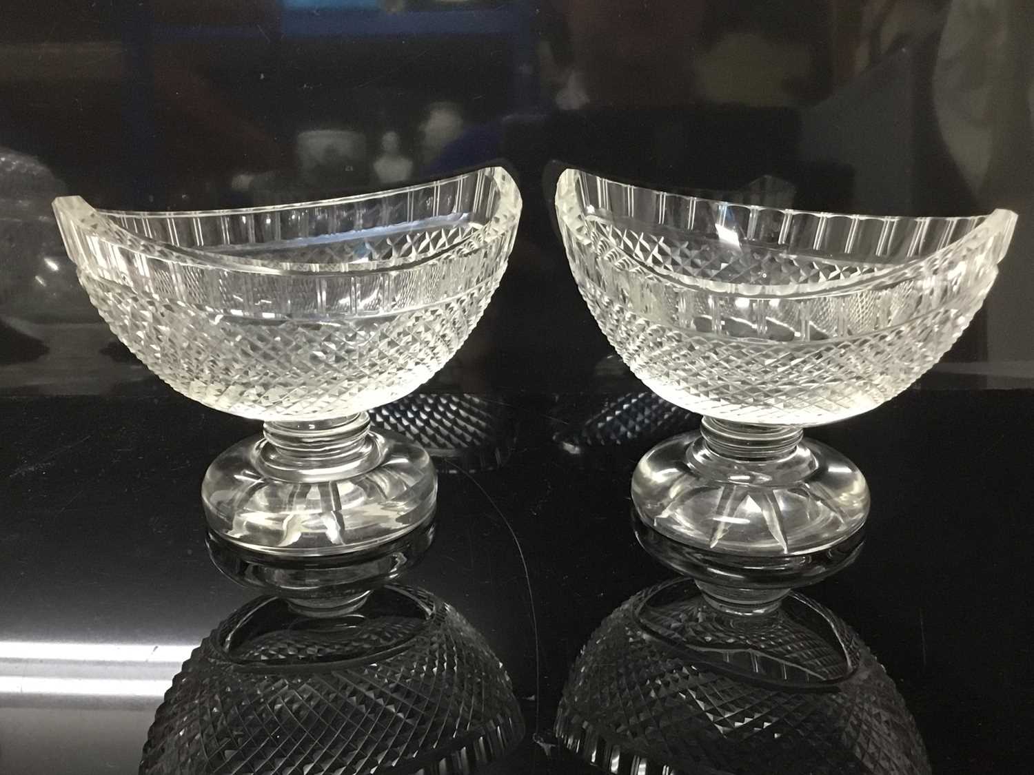 Pair of good quality Edwardian cut glass salts or bon bon dishes, of boat-shaped form, on circular p