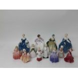 Eleven Royal Doulton figures and a Coalport figure