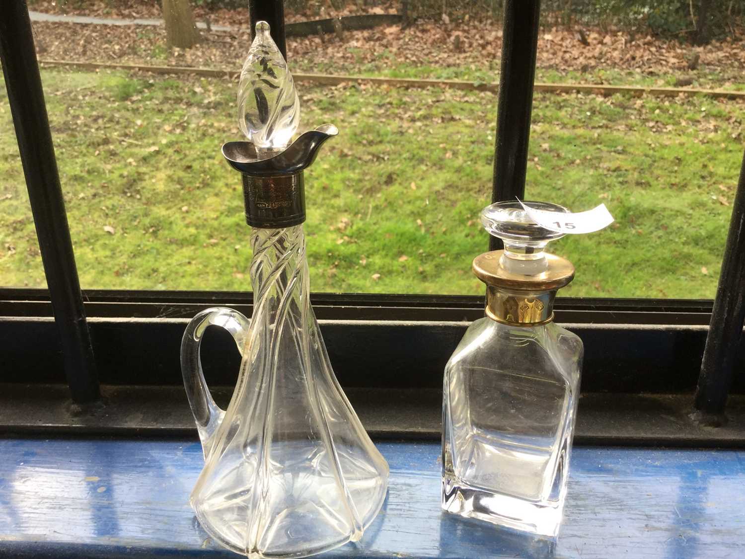 Silver mounted tapered glass spirit decanter, together with a silver gilt mounted glass scent bottle