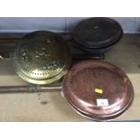 Group of four antique copper and brass warming pans (4)