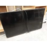 LG flatscreen television, model number 43UJ634V with remote control