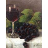 A. Liebau, late 19th/early 20th century oil on board - still life of a wine glass and grapes, signed