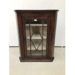 19th century stained pine corner cupboard with glazed doors enclosing shelves, 76cm wide x 97cm high