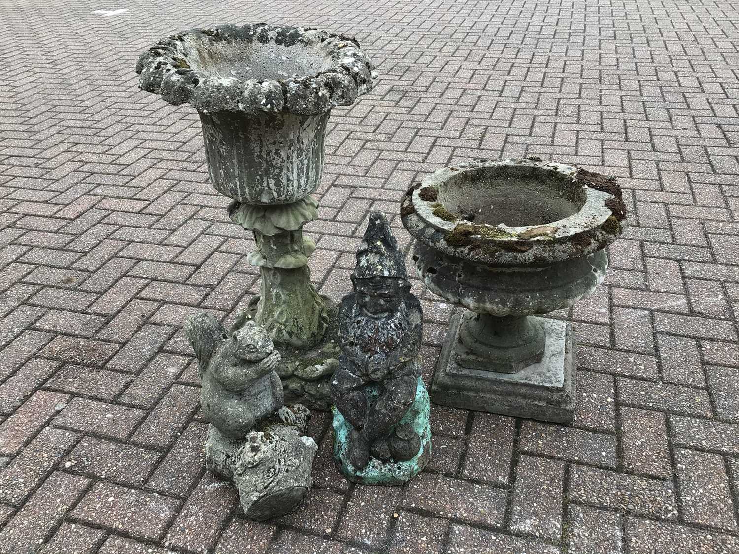 Selection of four concrete garden ornaments to include two planters, gnome and a squirrel