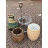 Metal two tier plant stand, wooden shovel together with three other garden ornaments
