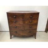 Georgian mahogany bow front chest of tow short and three long drawers with bun handles, on splayed b
