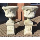 Pair concrete garden urns on plinths H107, W57, D57cmCondition report: Good condition but some