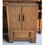 1920's oak cabinet with two panelled doors and single drawer below