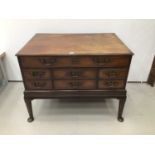 Georgian mahogany chest on stand with an arrangement of drawers, the top long drawer enclosing pigeo