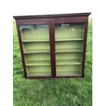 Georgian mahogany bookcase with dentil cornice, twin glazed doors enclosing adjustable shelves with