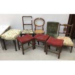 An assortment of eight chairs and stools to include three matching dressing stools