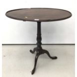 19th century mahogany tripod wine table, the oval top raised on turned column and three splayed legs