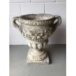 Large concrete urn with floral decoration and twin handles on square base H76, W68, D49cm