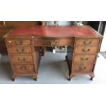 Georgian style mahogany twin pedestal desk with tooled red leather top and nine drawers on cabriole