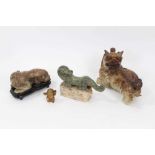 Four Chinese carvings, including a horn figure, a bronze beast on a hardstone base, a jadeite foo do
