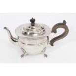 Edwardian silver teapot of circular form with pie crust border, domed hinged cover with bakelite fin