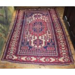 Eastern rug, with cream field centred by concentric medallion within multiple borders with tassel en