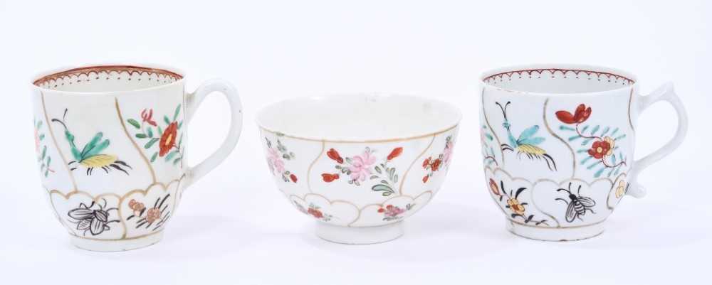 Lowestoft coffee cup and tea bowl, painted with various insects and flower sprigs within gilded comp