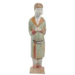 Old Chinese pottery tomb figure, shown standing with hands joined and wearing a long robe, polychrom