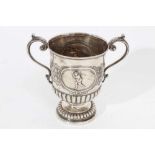 George V Scottish silver two handled trophy cup of conventional form with fluted decoration, embosse