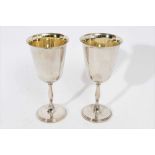 Pair of Elizabeth II silver goblets of inverted bell form, with gilded interiors and bulbous stems,