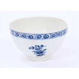 Lowestoft tea bowl, moulded with panels painted in blue with flowers, moulded flowers in between, wi